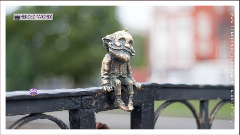 a statue of an old man sitting on a railing