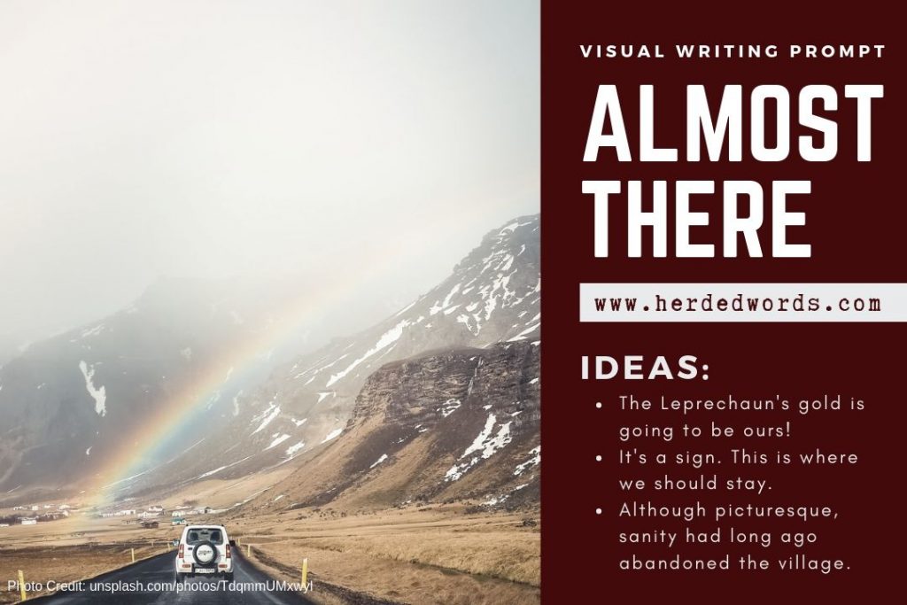 Visual Writing Prompt: Almost There! An image of a car driving into a small village under a rainbow.