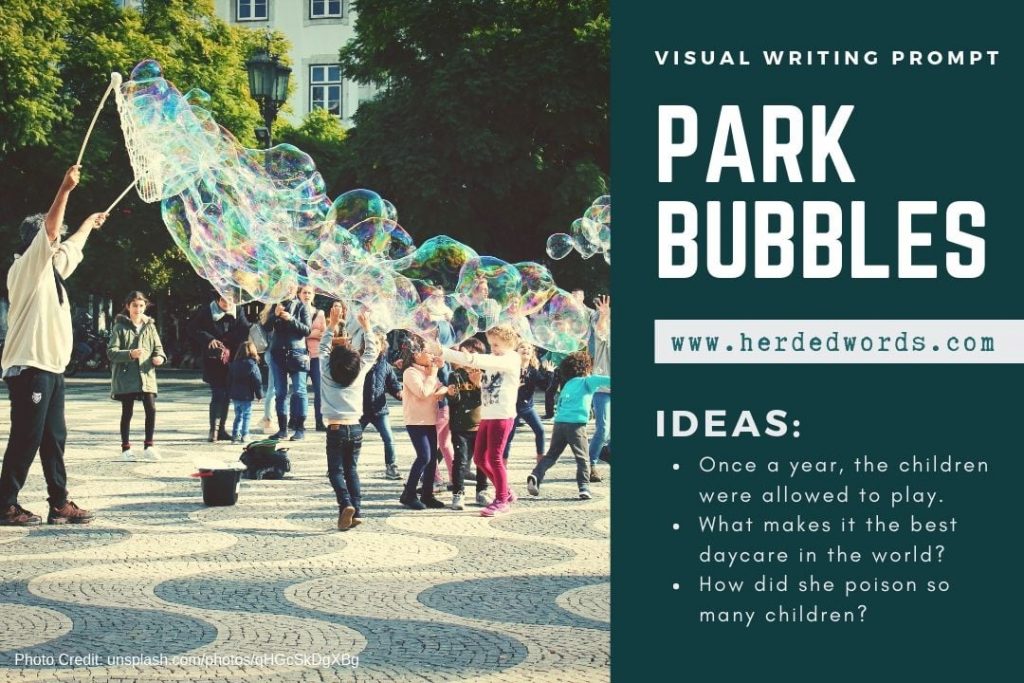 Visual writing prompt: park bubbles (a group of children playing with large bubbles made by an adult)